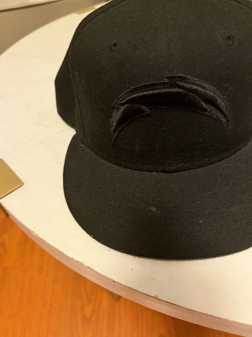 Black Snapback Hat with Subtle Raised Logo
LA Charger)
